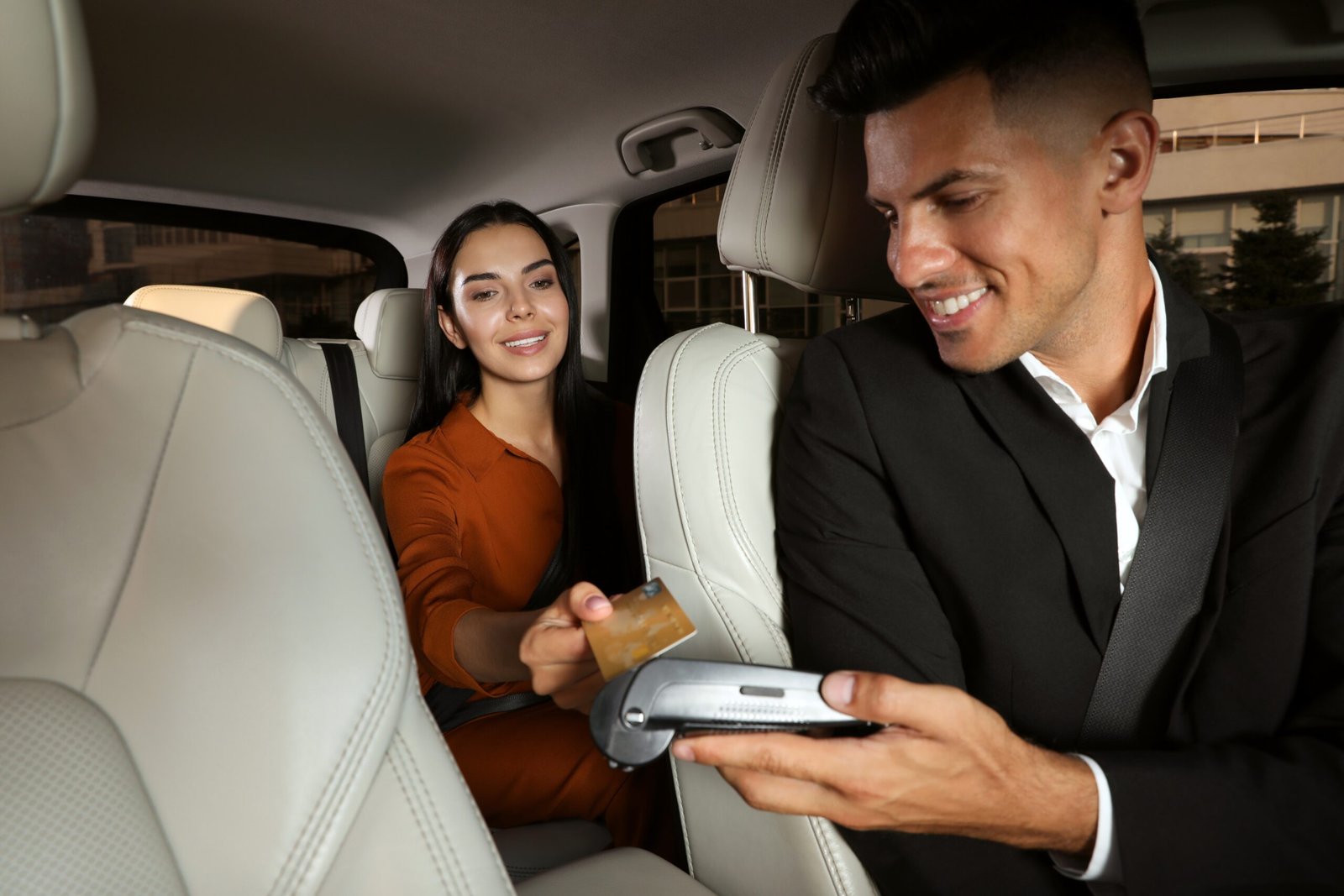 Young,Woman,Paying,For,Service,Using,Credit,Card,Via,Payment